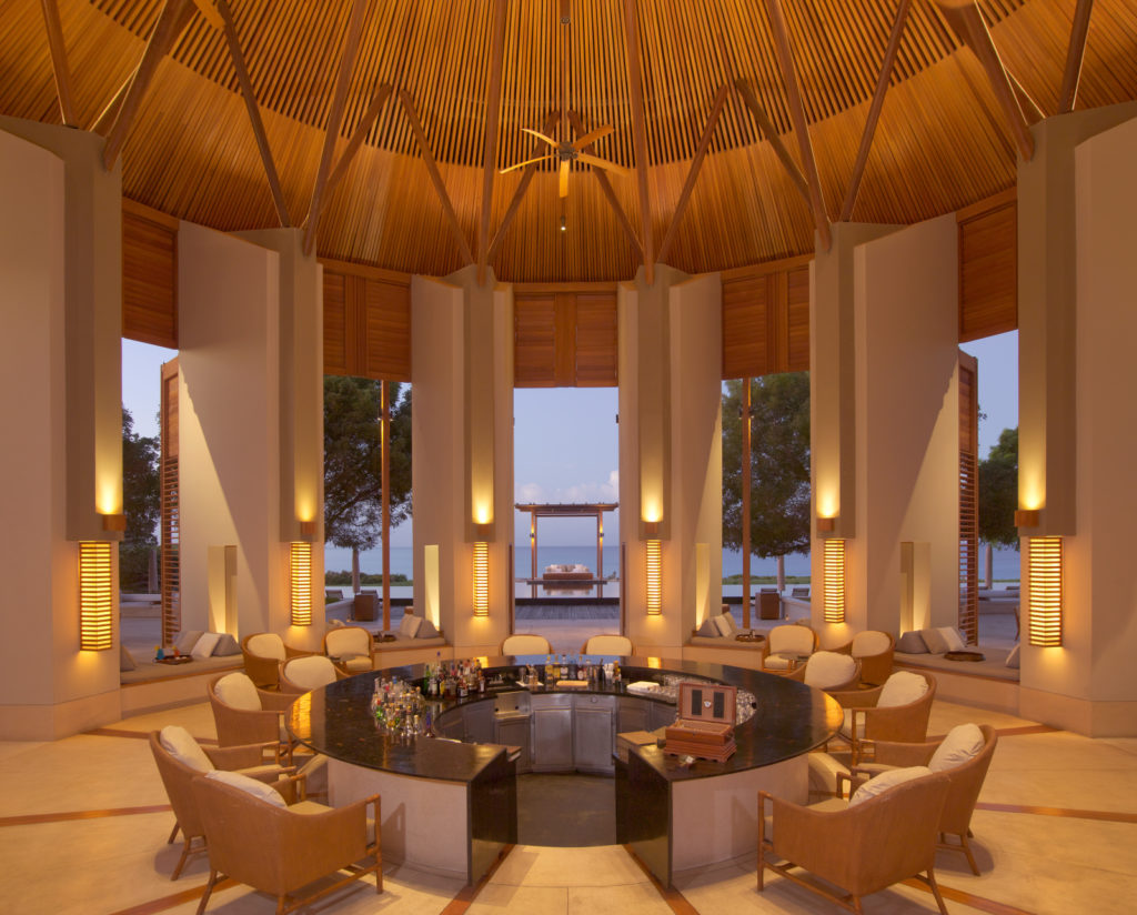 The Bar at Amanyara is impeccably designed to frame the turquoise blue waters and the nightly sunsets. 