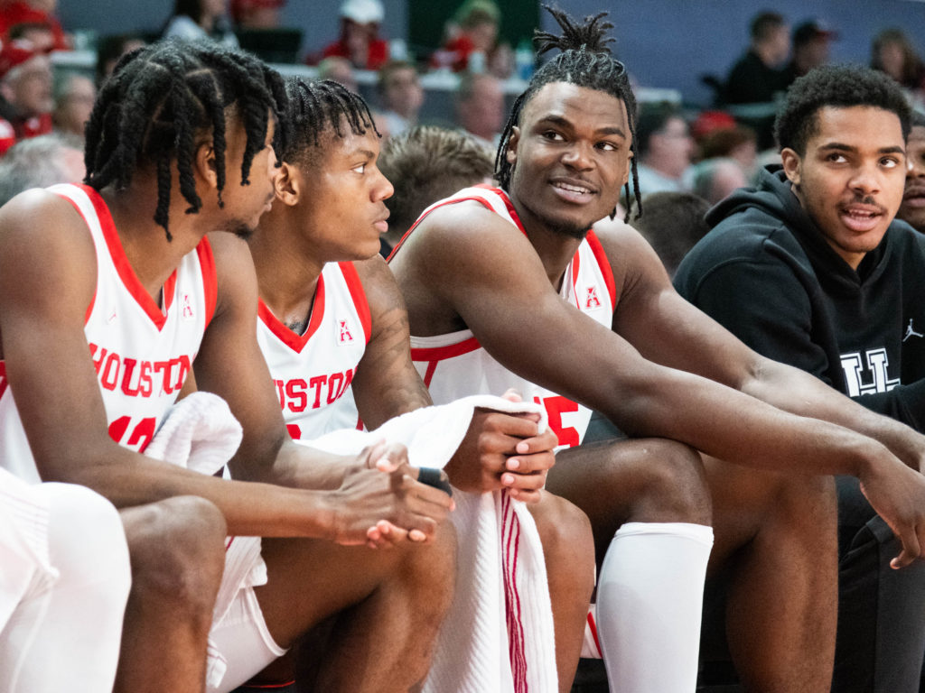 Even when he's on the bench, Jarace Walker (far right) enjoys hanging with Tramon Mark (left) and Marcus Sasser. (Photo by F. Carter Smith)