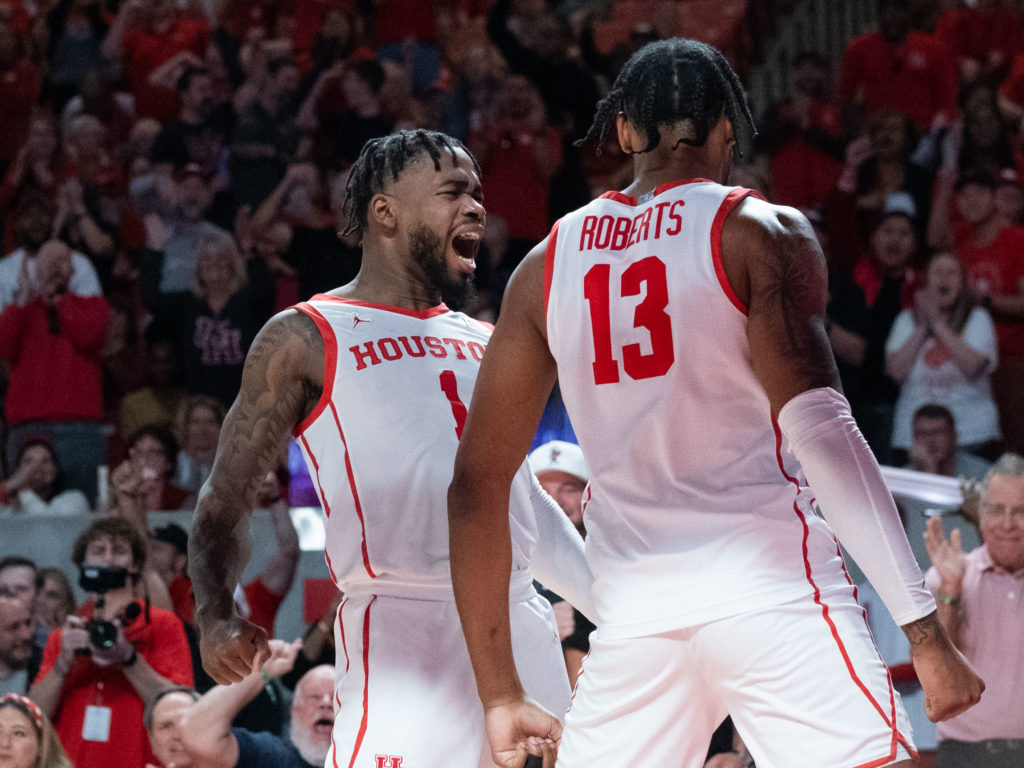 University of Houston point guard Jamal Shead is pumped up by what J'Wan Roberts is doing. (Photo by F. Carter Smith)