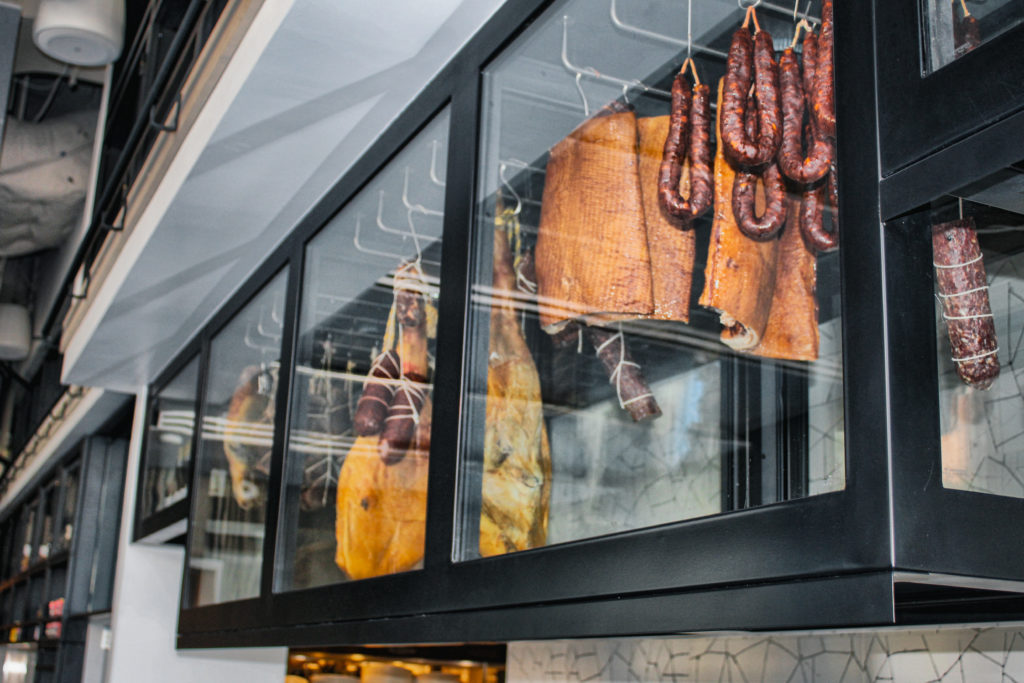 Behold the Ham Bar or aging vault filled will cured meats, chef Steve McHugh's underlying passion. Photo by Mary Whitten.