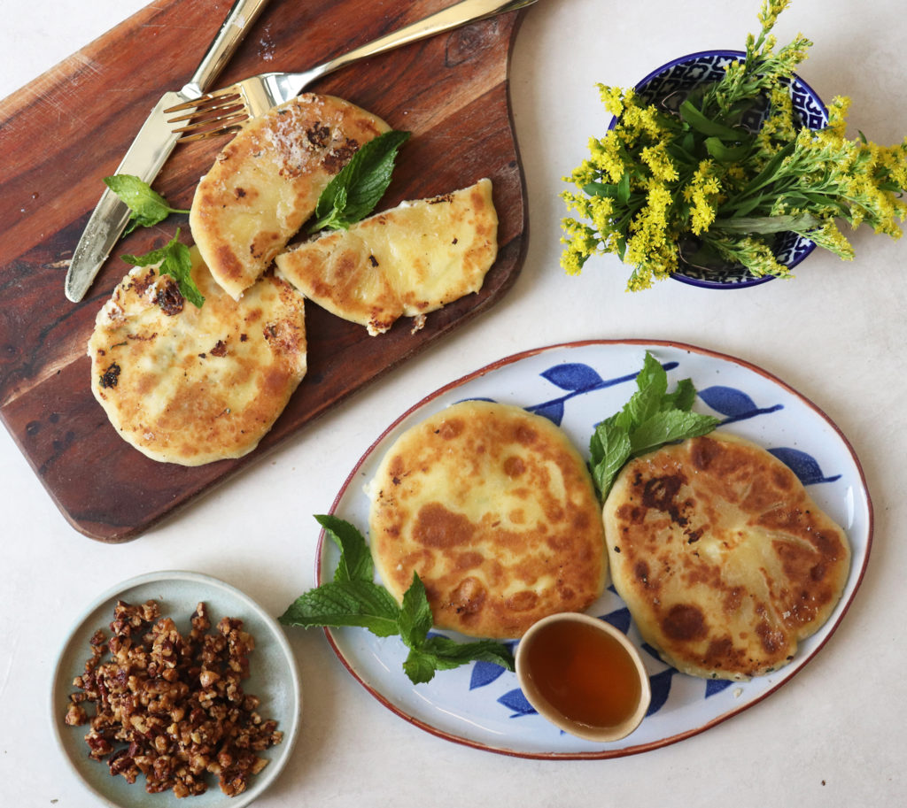 The Mizithrapita – a cheese-stuffed pancake with a honey drizzle and nut crumble. (Photo by Ajna Jai)