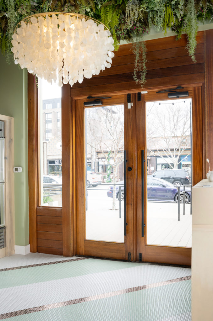 A breezy, coastal entrance at Quarter Acre restaurant. (Photo by Emily Loving)
