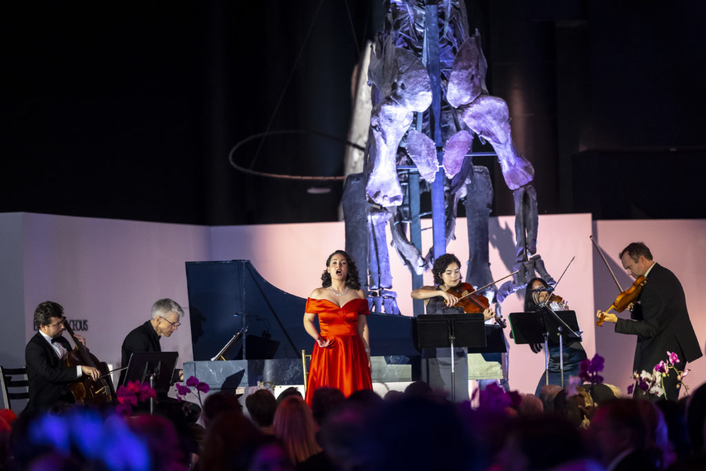 Ars Lyrica musicians and soprano Camille Ortiz perform among the prehistoric critters at the Houston Museum of Natural Science.  (Photo by Annie Mulligan)