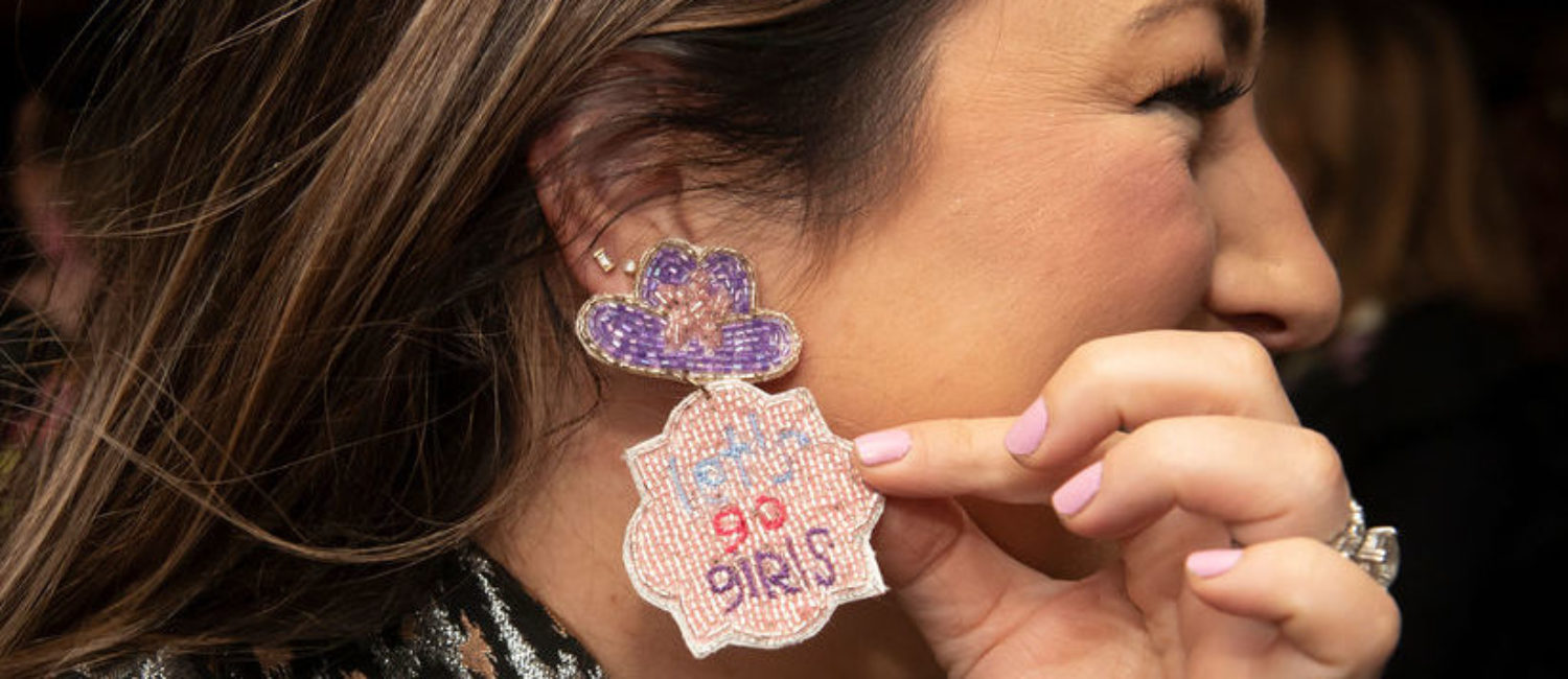 A party guest channeling Shania with her earrings (Photo by Tamytha Cameron)
