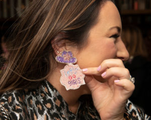 A party guest channeling Shania with her earrings (Photo by Tamytha Cameron)