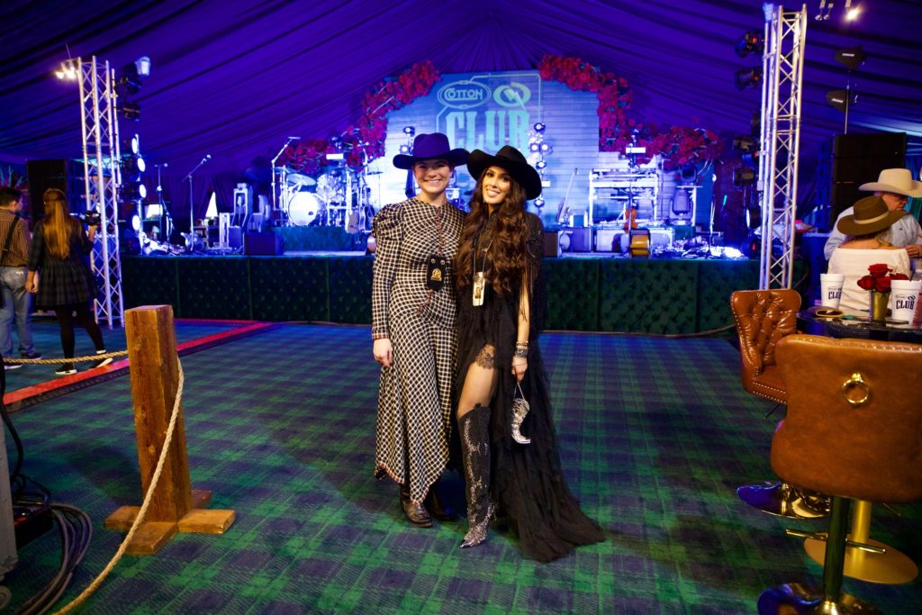 Audrey Sarver, Zinat Ahmed at Cotton Holding's Houston Livestock Show & Rodeo barbecue cook-off party. (Photo by Ashley Patranella, Painted Peacock Photography)