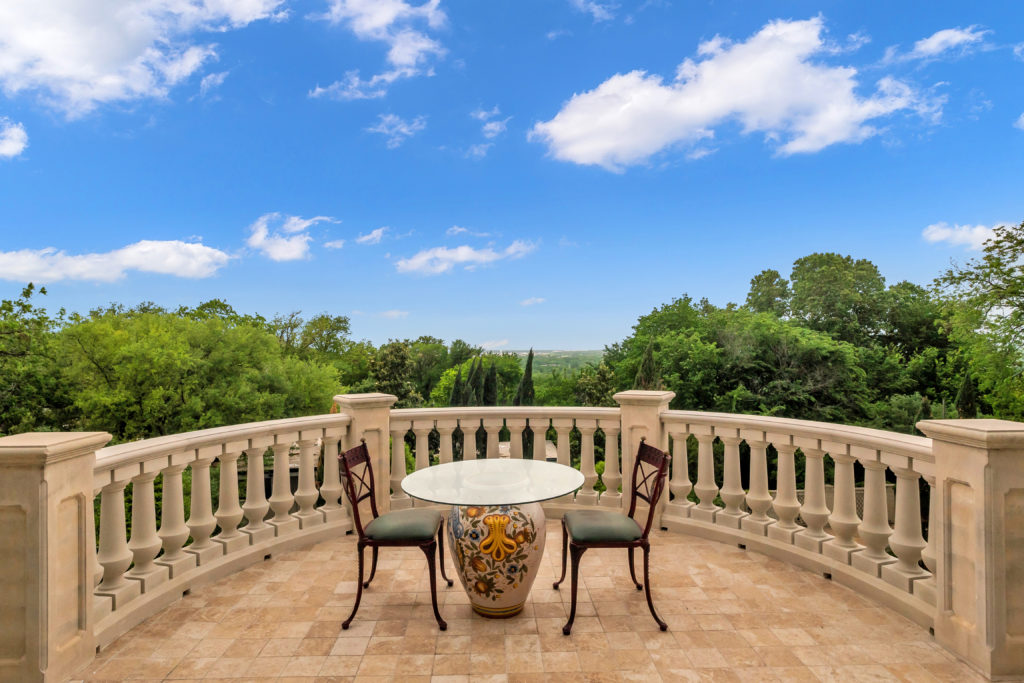 The balustraded upstairs balcony with a view at the Baldridge estate in Fort Worth.