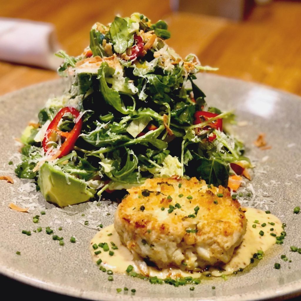 Best – Pacific Table – The legendary crab cake salad settles into its mustard sauce at Pacific Table.