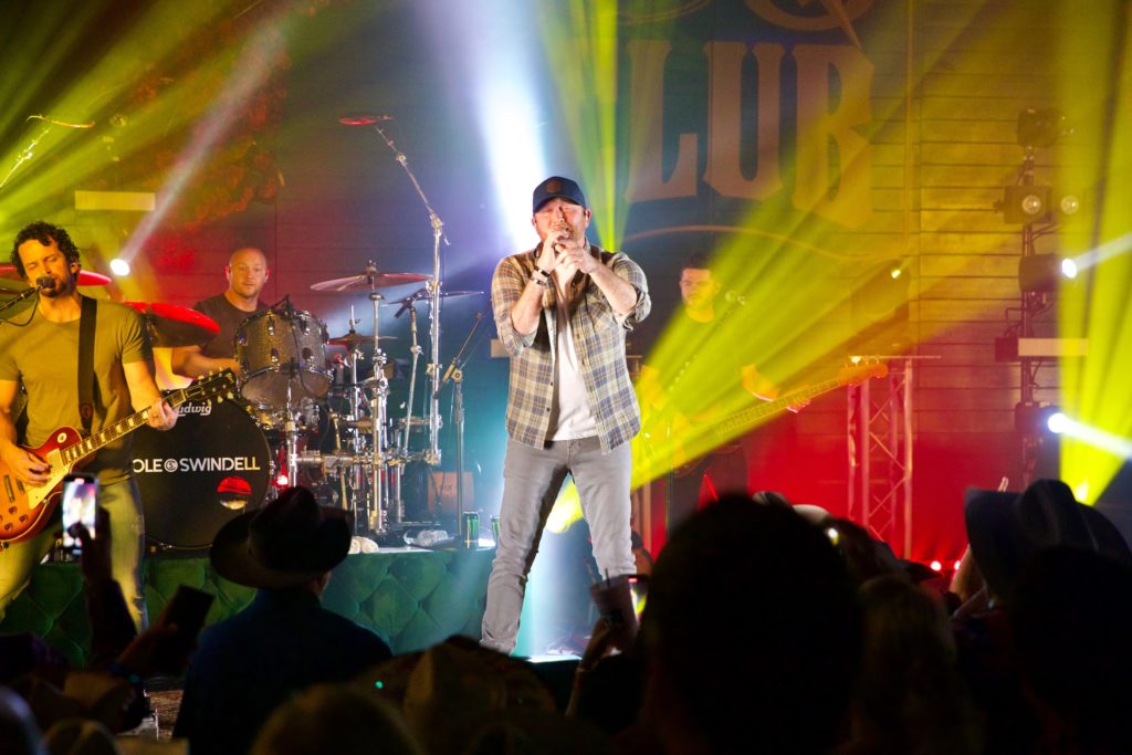 Grammy-nominated Cole Swindell performs at Cotton Holding's Cotton Q Club at the Houston Livestock Show & Rodeo barbecue cook-off. (Photo by Ashley Patranella, Painted Peacock Photography)