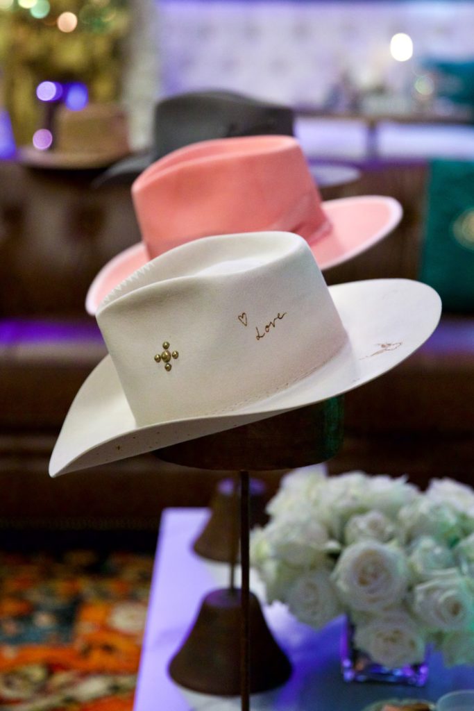 Teressa Foglia hats on display in Cotton Holding's Gold Pony VIP lounge at the Houston Livestock Show & Rodeo barbecue cook-off. (Photo by Ashley Patranella, Painted Peacock Photography)