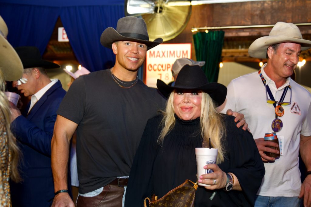 Hunter Bell, Lara Bell at Cotton Holding's Houston Livestock Show & Rodeo barbecue cook-off party. (Photo by Ashley Patranella, Painted Peacock Photography)