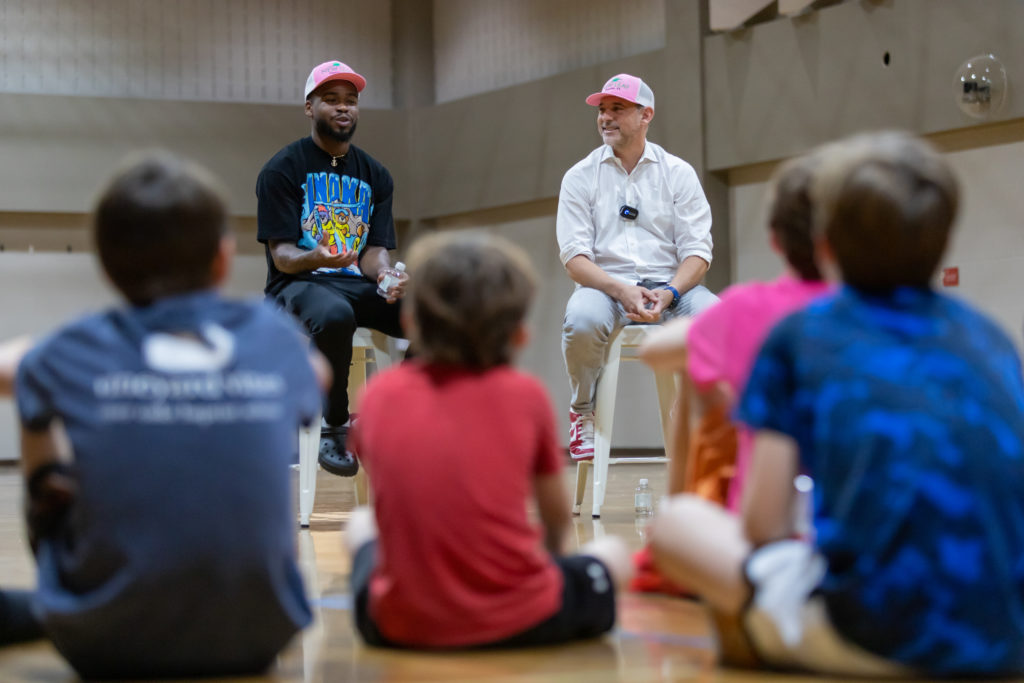 UH point guard Jamal Shead talked with the kids with New Leaf real estate founder David Houston helping lead the discussion. (Courtesy New Leaf real estate)