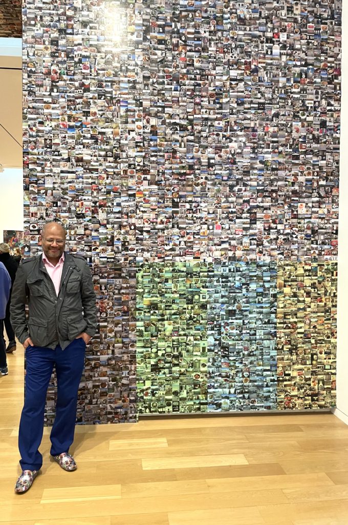 Artist Hasan Elahi poses in front of his monumental work Thousand Little Brothers v7. (Photo by Courtney Dabney)
