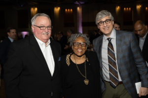 visit – Bob Jameson with the grandmother of Juneteeth, local celebrity Opal Lee, pose with Mo Rocca.