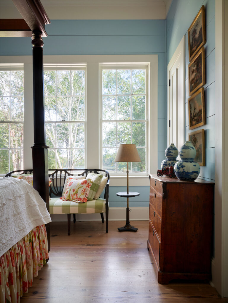A guest bedroom furnished with antiques and family heirlooms, including a settee discovered in the barn. (Photo by PÄR BENGTSSON)