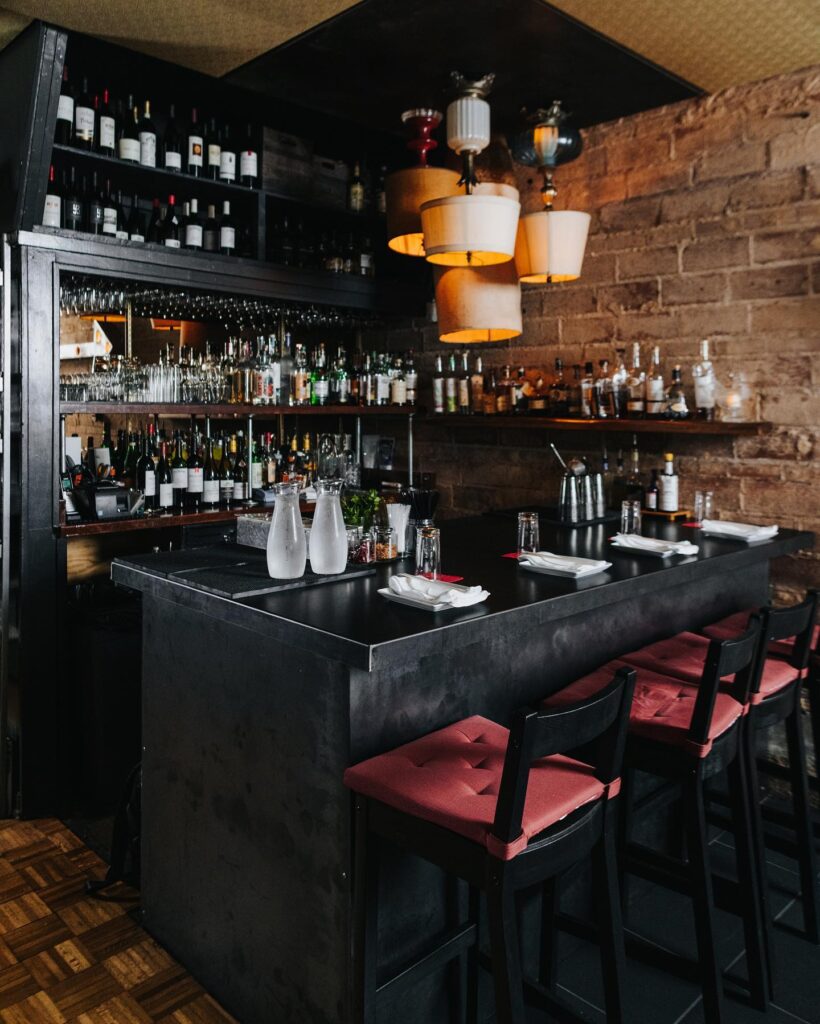 The bar at Mot Hai Ba offers craft cocktails, wine, and beer. (Photo by Kathy Tran)