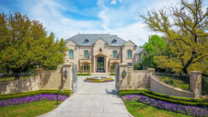 The entry and curb appeal of the multi-million dollar Fort Worth estate at 4400 Overton Crest is real.