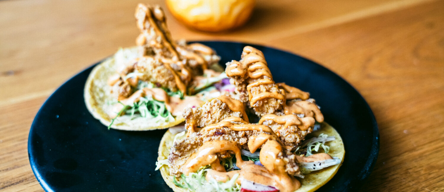 Eight Row Flint is known for making their own homemade tortillas. Try one with Baja popcorn shrimp. (Photo by Mikah Danae)