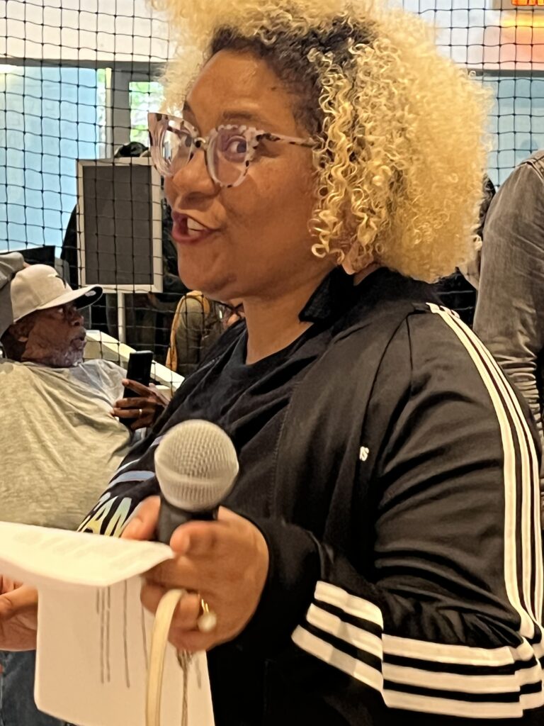 CAMH deputy director Seba Raquel Suber addresed the basketball- and art-obssessed crowd at CAMH COURT on opening day, Saturday, March 18, 2023. (Photo by Lester Marks)