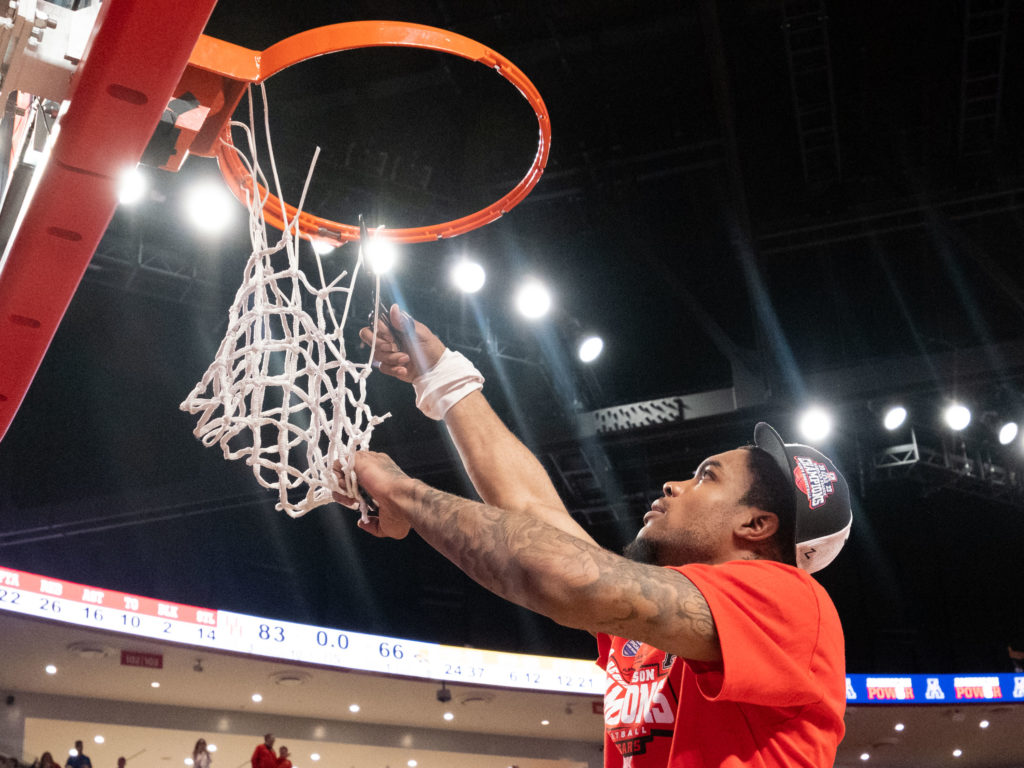 Cutting yourself off a chunk of net is one of college basketball's great traditions.  (Photo by F. Carter Smith)