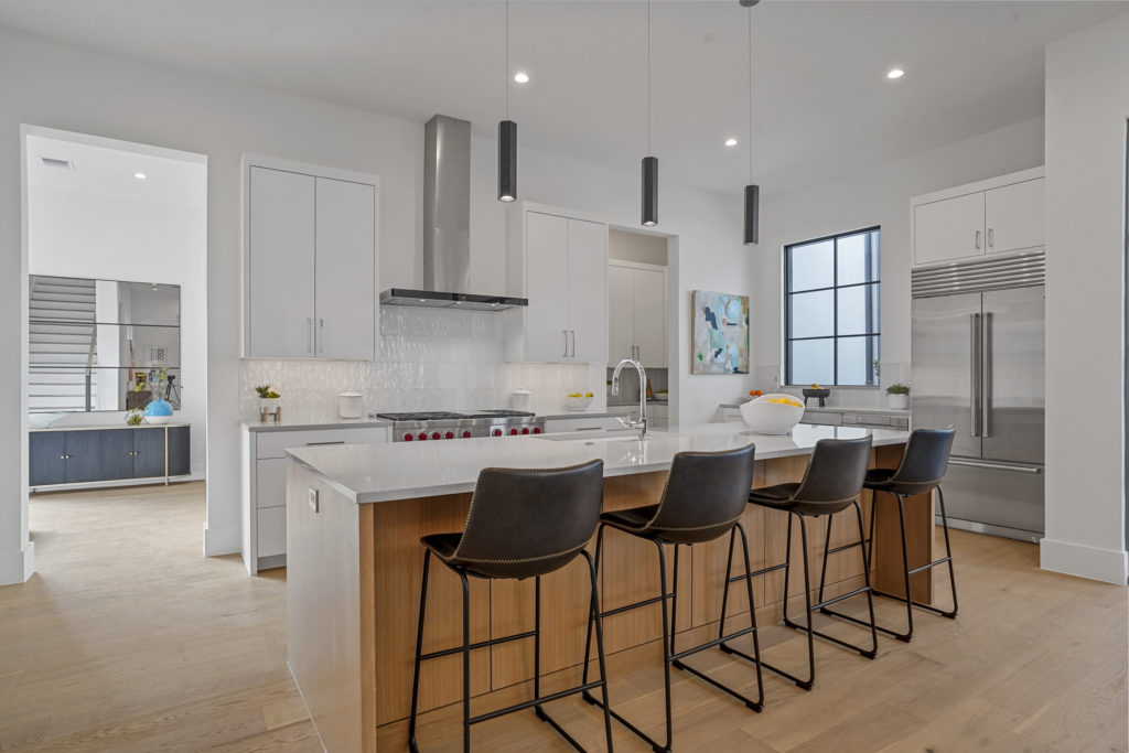 The entertainer's kitchen at 9716 Kerrisdale Lane includes an elevated Sub-Zero appliance package.