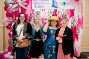 Down – Kimberly Blackmon, Candace Moffitt, Lauren Fairchild, Emily Landrum attend Bubbles, Boots, and Bingo.