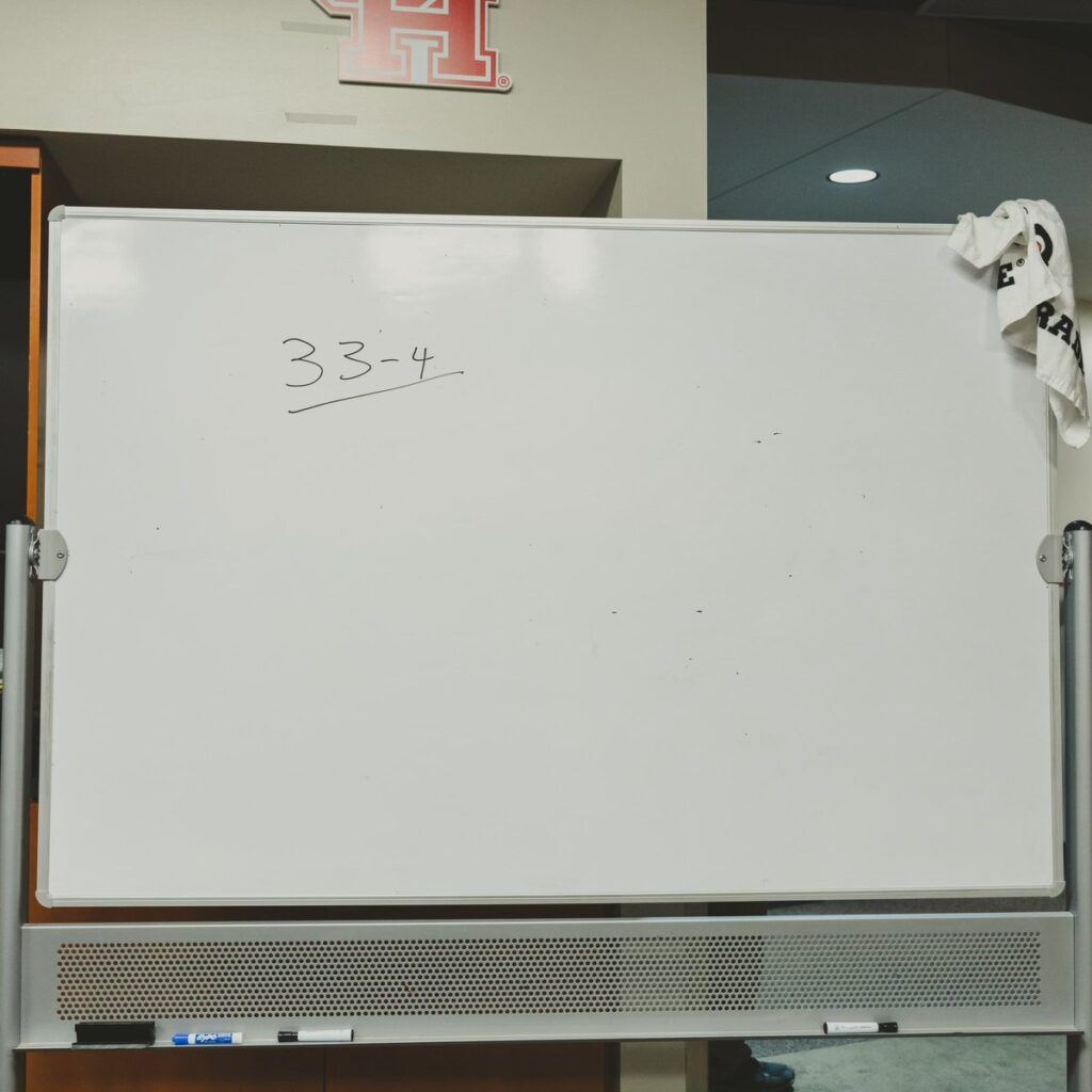 University of Houston coach Kelvin Sampson wrote 33-4 on the whiteboard in the UH locker room after this special team's season ended with a Sweet 16 loss to Miami. (@UHCougarMBK)
