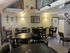 Tables, chairs and couches fill the tasting room indoors. Rooms upstairs can host various parties and celebrations.