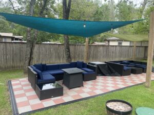 The patio has comfortable couches and fire pits to enjoy outdoors.