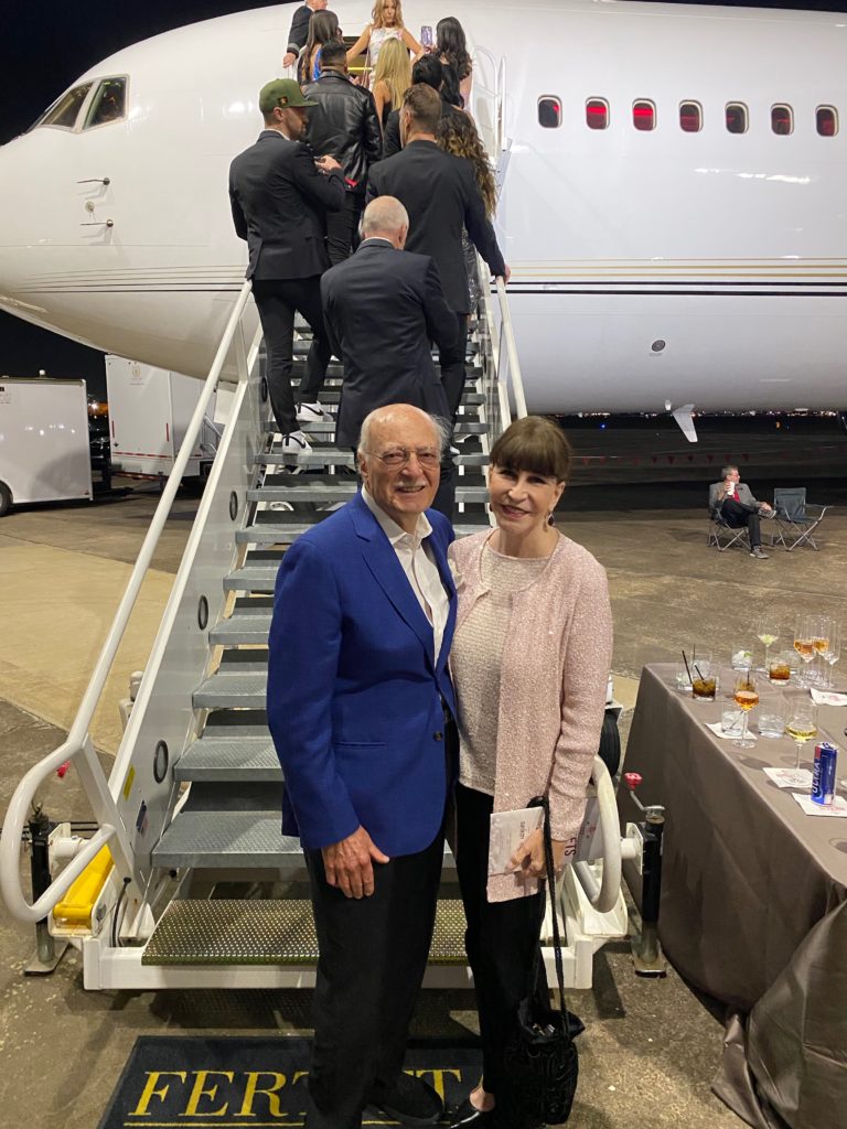 Shafik Rifaat and Shelby Hodge prepare to board the Houston Rockets team plane  at the Houston Rockets Clutch City Foundation gala at the Landry's hangar at Hobby Airport.