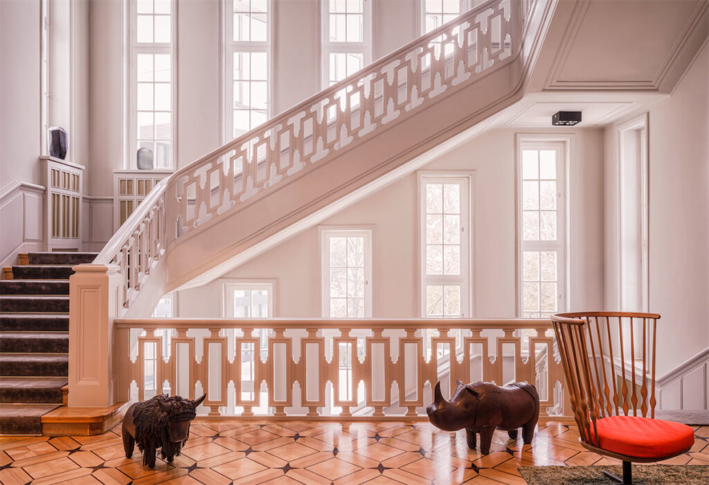 You’ll find interiors graced with elegant parquet floors, restored wooden inlays, and dramatic floor-to-ceiling windows at Das Stue. (Photo by Steve Herud)