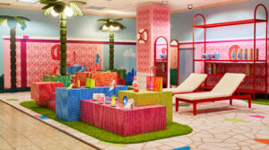 Merchandise displayed on neon glass tiles (Photo by Jonathan Zizzo)