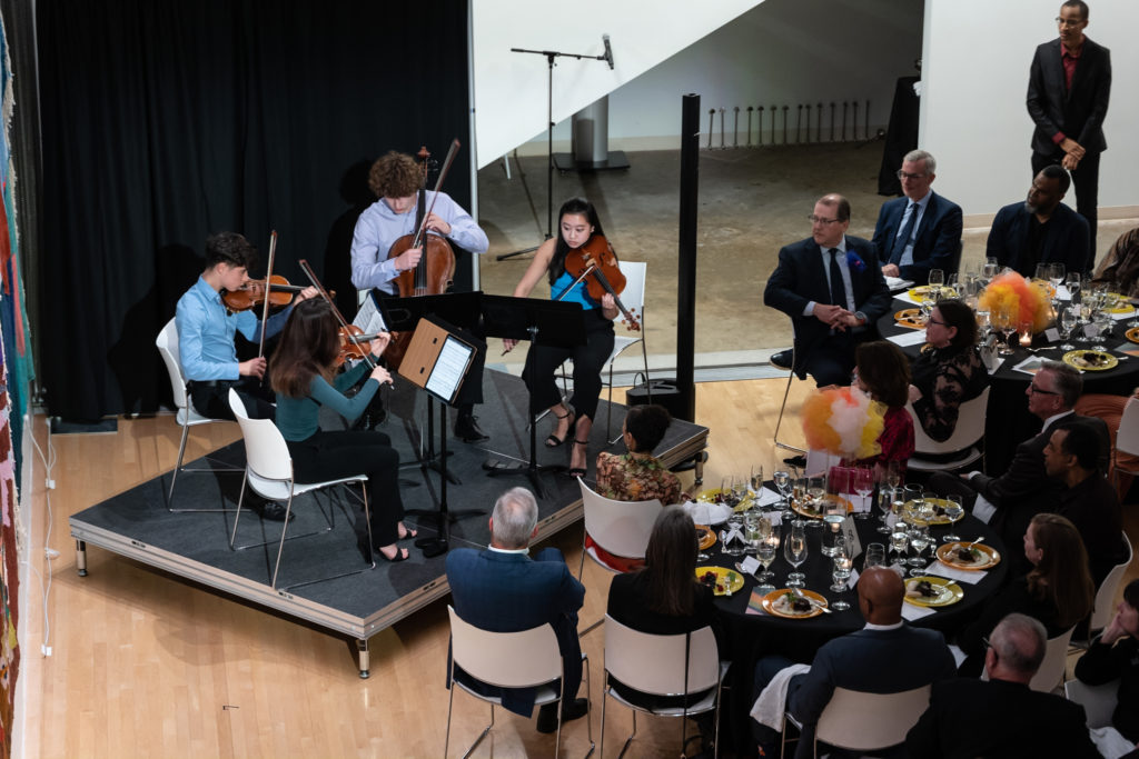 A string quartet performed an original arrangement inspired by Odita's new mural at Moody Center for the Arts' A Dinner for the Moody.   (Photo by Daniel Ortiz)
