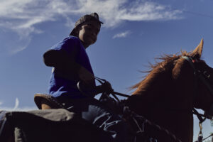 Young cowboy on trail ride