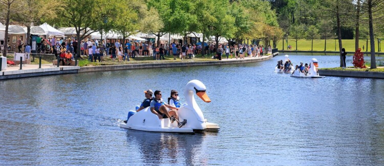 Artists have booths along the Waterway for The Woodlands Waterway Arts Festival.