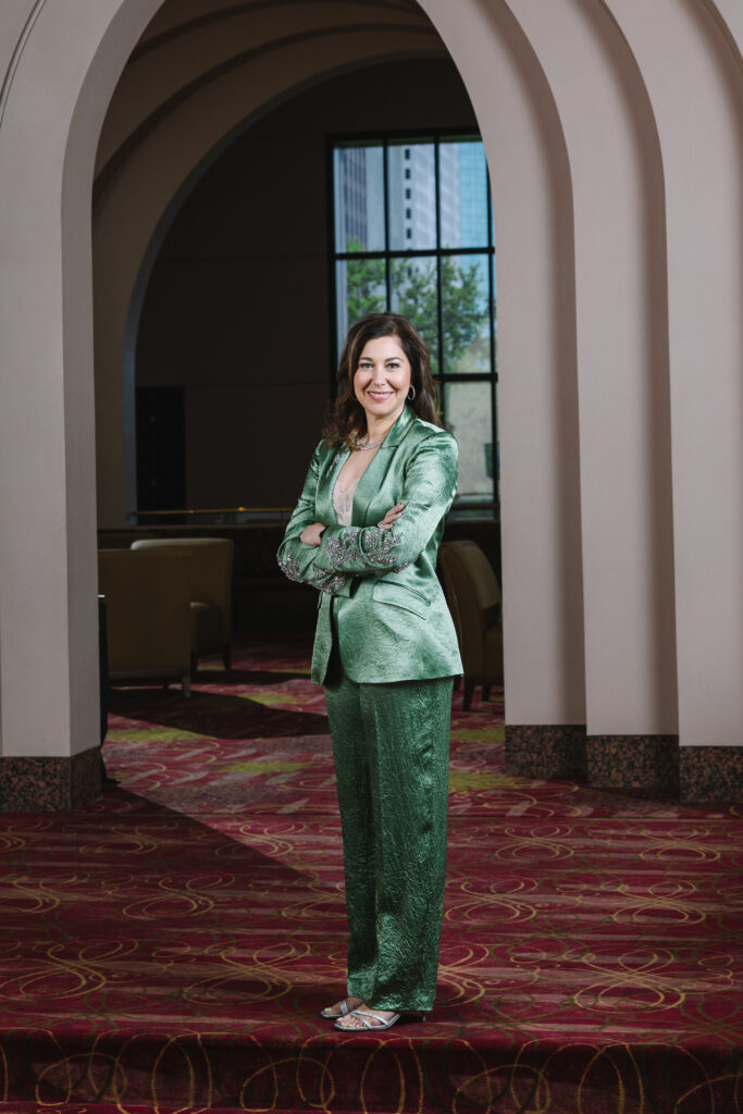 Jennifer Fink is wearing a Cinq a’ Sept blazer and pants from Tootsies. (Photo by Johnny Than)