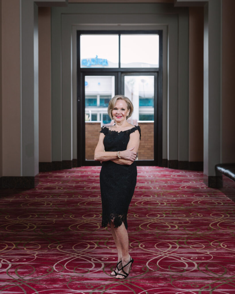 Janet Carrig is wearing a Romona Keveza dress from Tootsies. (Photo by Johnny Than)