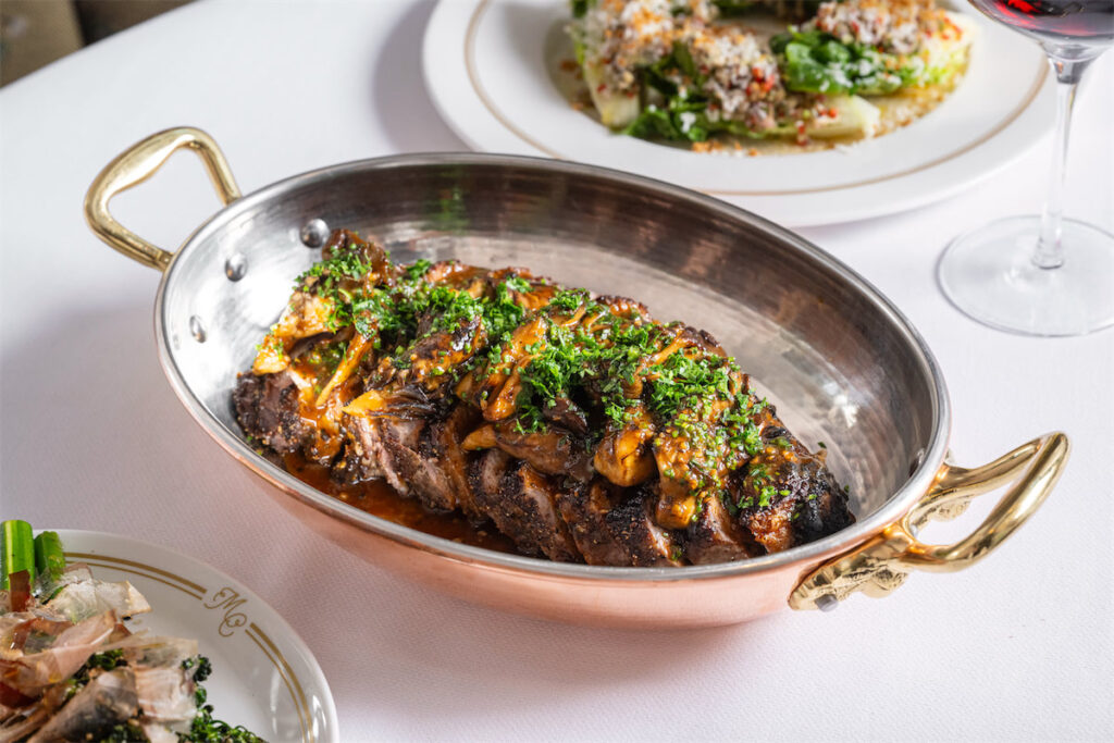 Mister Charles serves globally-inspired French and Italian dishes including steaks and seafood. (Photo by Evan Sung)