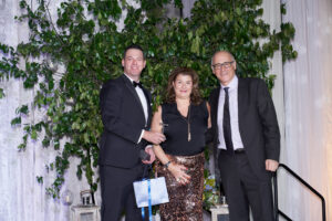 John Robichau (l) with the winners of the 2 carat white gold solitaire earrings.