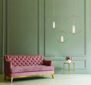 Pink sofa on the grey wall background. Minimalism interior