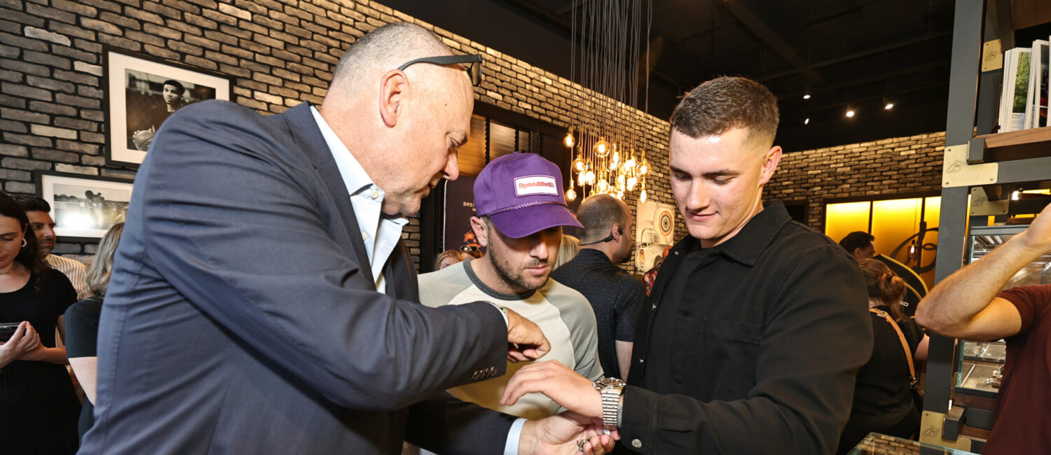 Thierry Prissert, Alex Bregman and Hunter Brown admire the watches. (Photo by Bob Levey/Getty Images for Breitling)