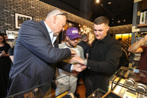 Thierry Prissert, Alex Bregman and Hunter Brown admire the watches. (Photo by Bob Levey/Getty Images for Breitling)