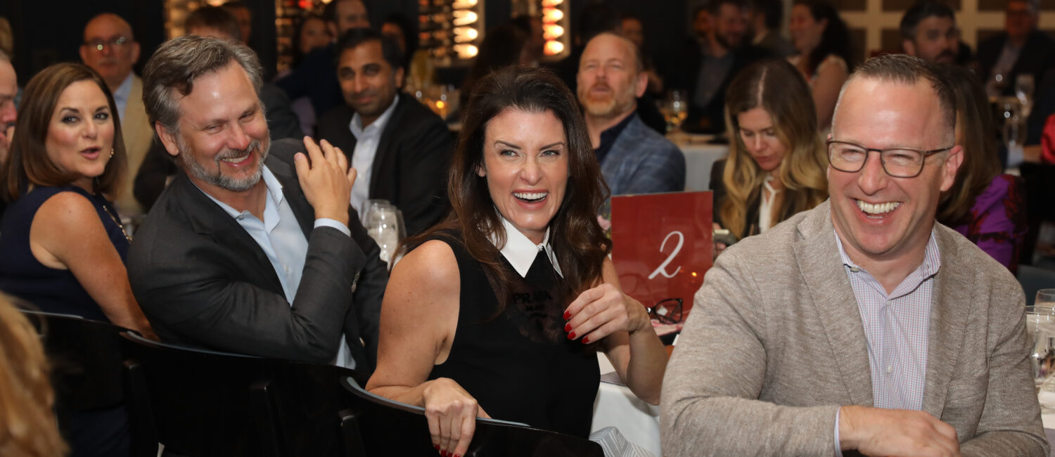 Jordan & Dylan Seff enjoy the heavy auction bidding at thebHouston Classical Charter School Foundational Dinner. (Photo by Priscilla Dickson)