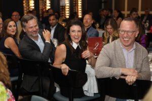 Jordan & Dylan Seff enjoy the heavy auction bidding at thebHouston Classical Charter School Foundational Dinner. (Photo by Priscilla Dickson)