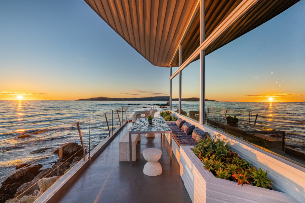 The wrap-around porch instantly transports you off the coast and into the sea. (Photo by Sherman Chu)