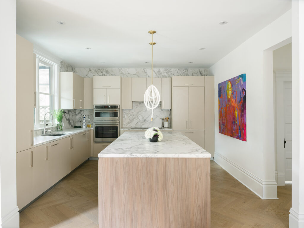This historic Montrose renovation paired the Cesar Maxima 2.2 cabinets in Hemp LM50 with an island in Chestnut Brown Walnut topped with Porcelain countertops in Arabescato Matte. (Photo by Divya Pande)