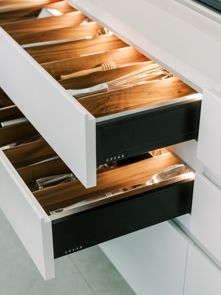 Details of the Maxima 2.2 in Silk Lacquer White with walnut and stainless-steel cutlery inserts. (Photo by Divya Pande)