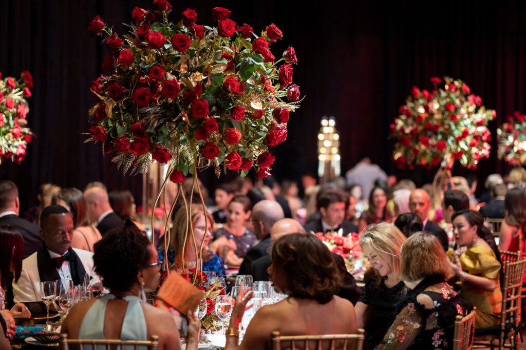 Large vases of red roses served as centerpieces at the Houston Grand Opera Ball. (Photo by Katy Anderson)
