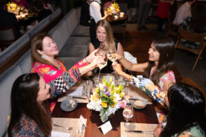 Cheers! Guests at Houston Ballet's Raising the Barre dinner fundraiser toast the tasty evening. (Photo by Wilson Parish)