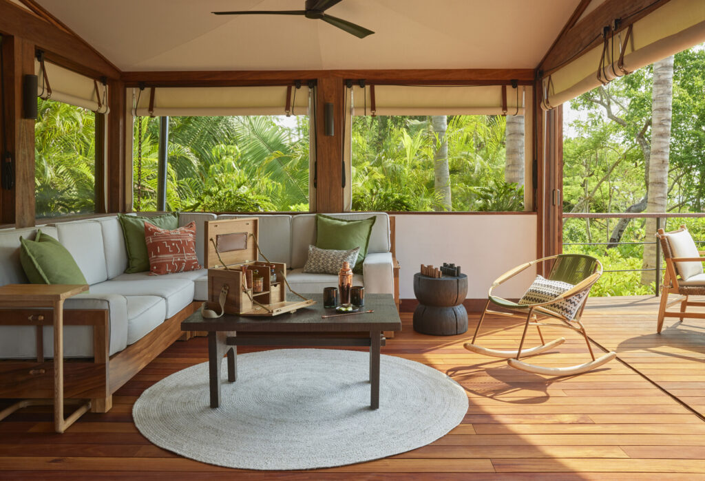 The screened in lounge area is a serene setting within Naviva's luxury tents. 